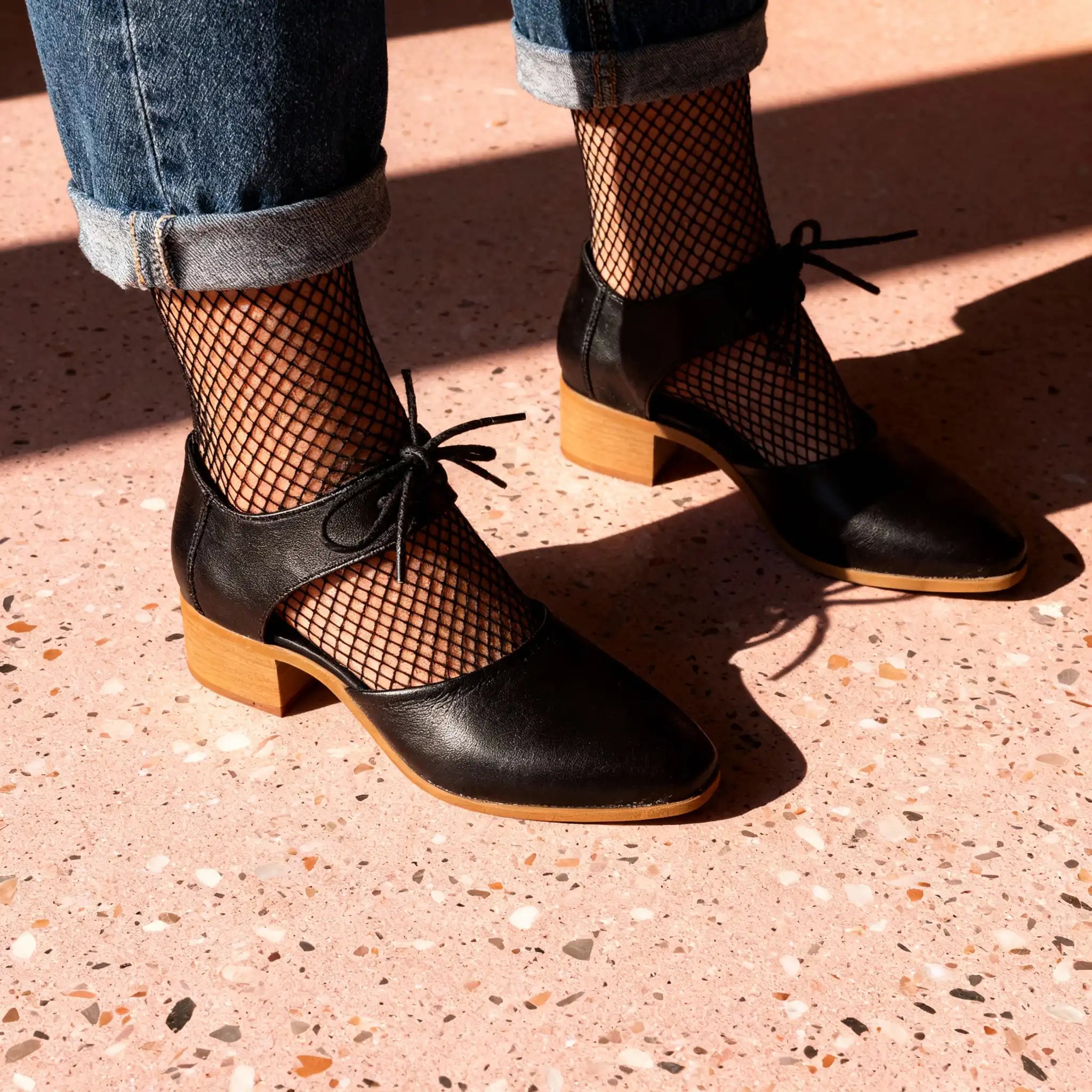 A woman wears a pair of Shona, vegan shoes by Zette Shoes
