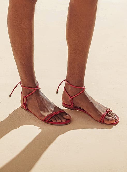 Flat vegan toe-strap sandal by Arenaria - red